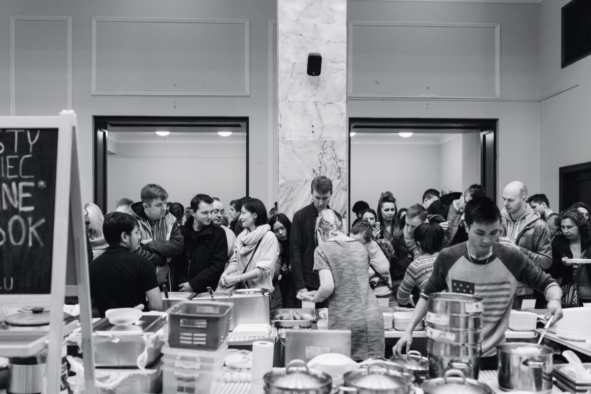 Food stalls and crowds of people at the Palace of Culture in Warsaw