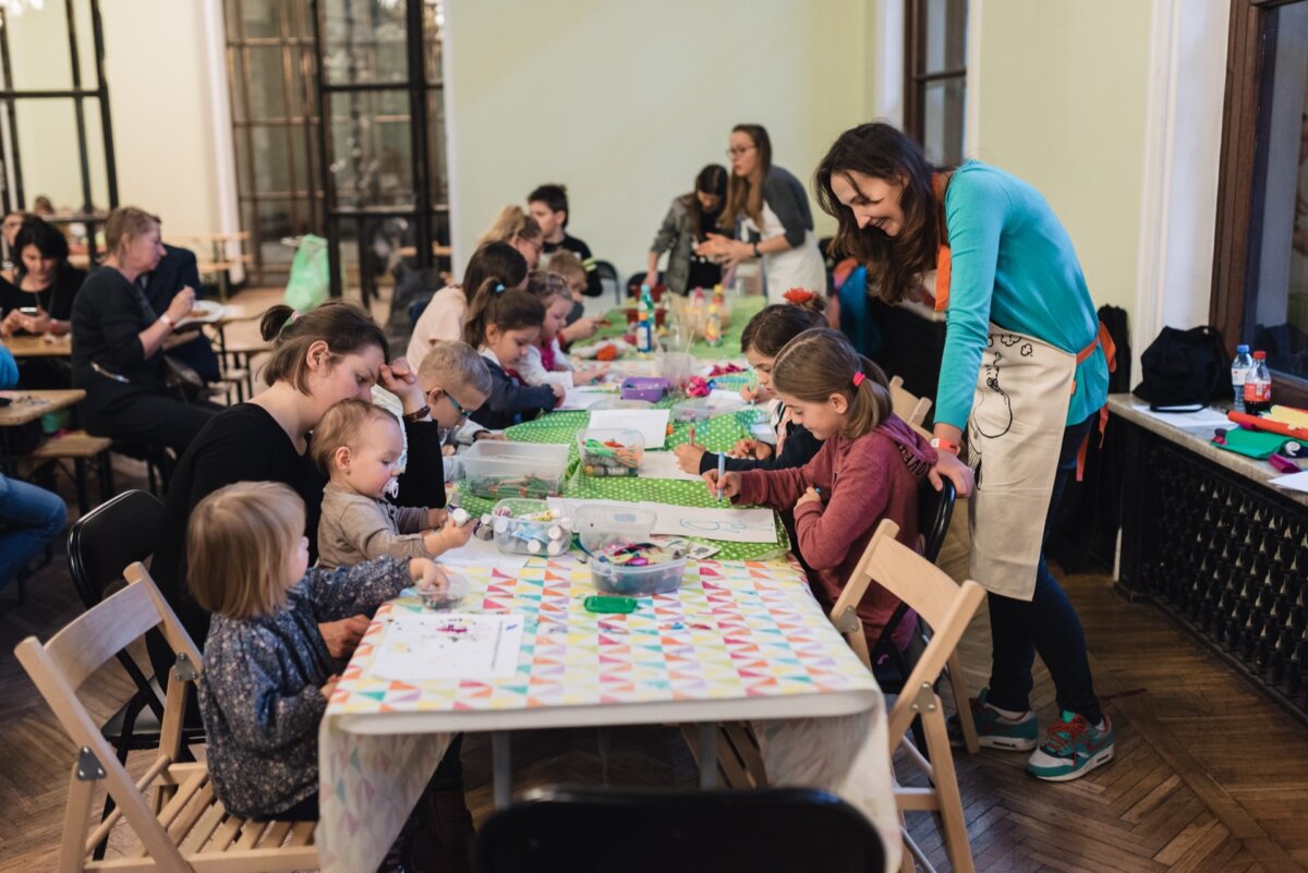 Children draw and paint on special tables