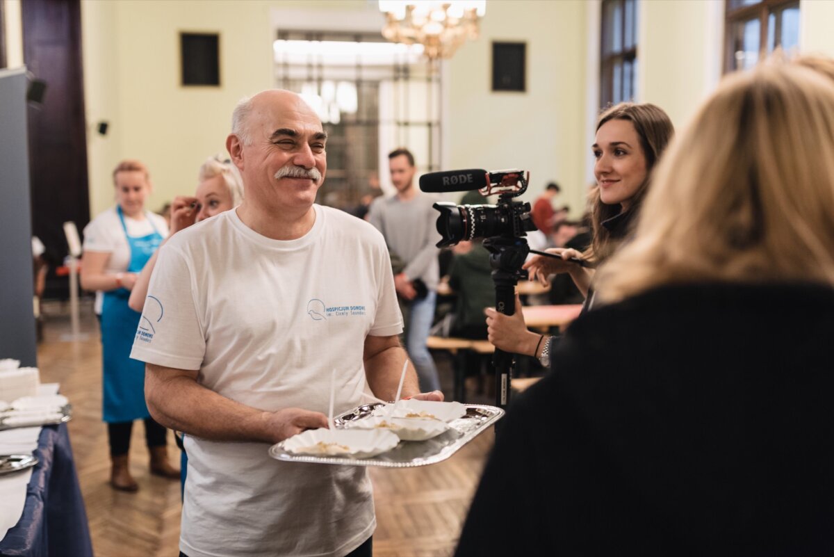 Man with mustache speaks to camera about dumplings