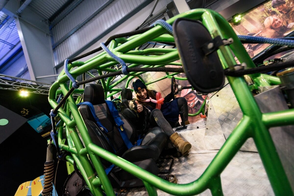 A girl in an all-terrain vehicle made of pipes