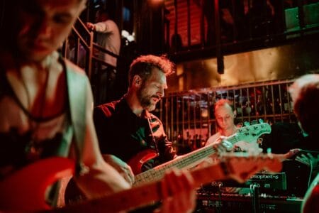 Concert with live music club men play guitars