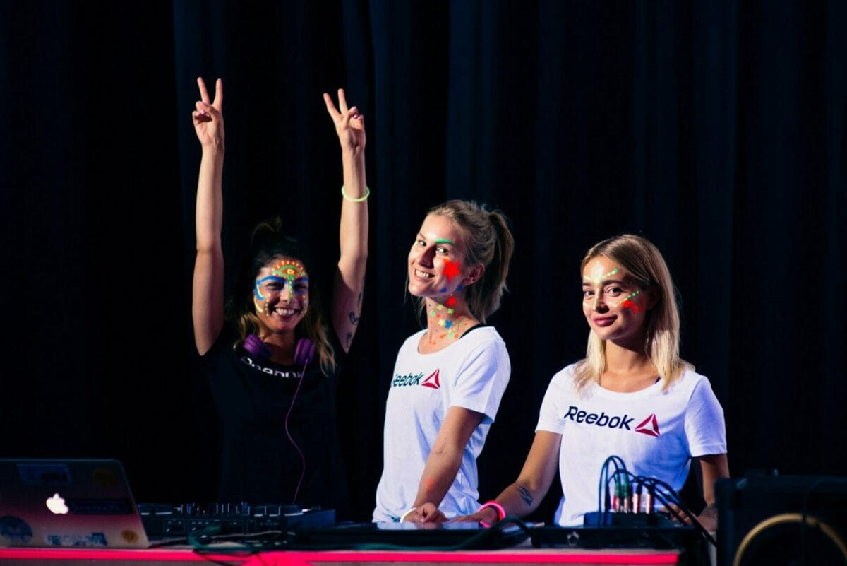 girls behind the console in reebok shirts