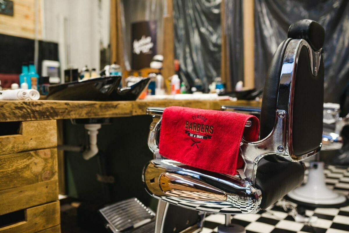 red towel on the back of the chair in the barbershop