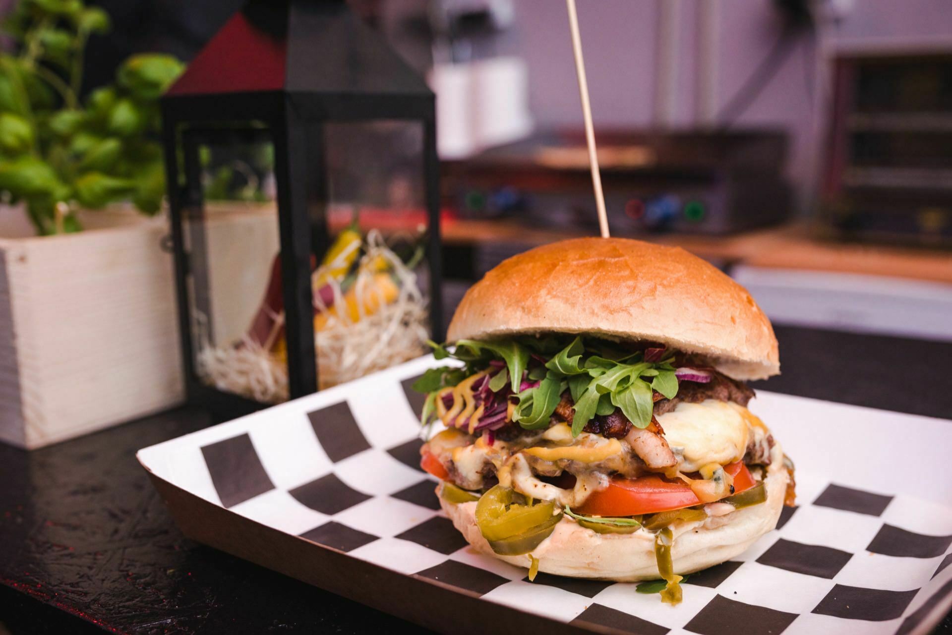 Big burger on a griddled tray