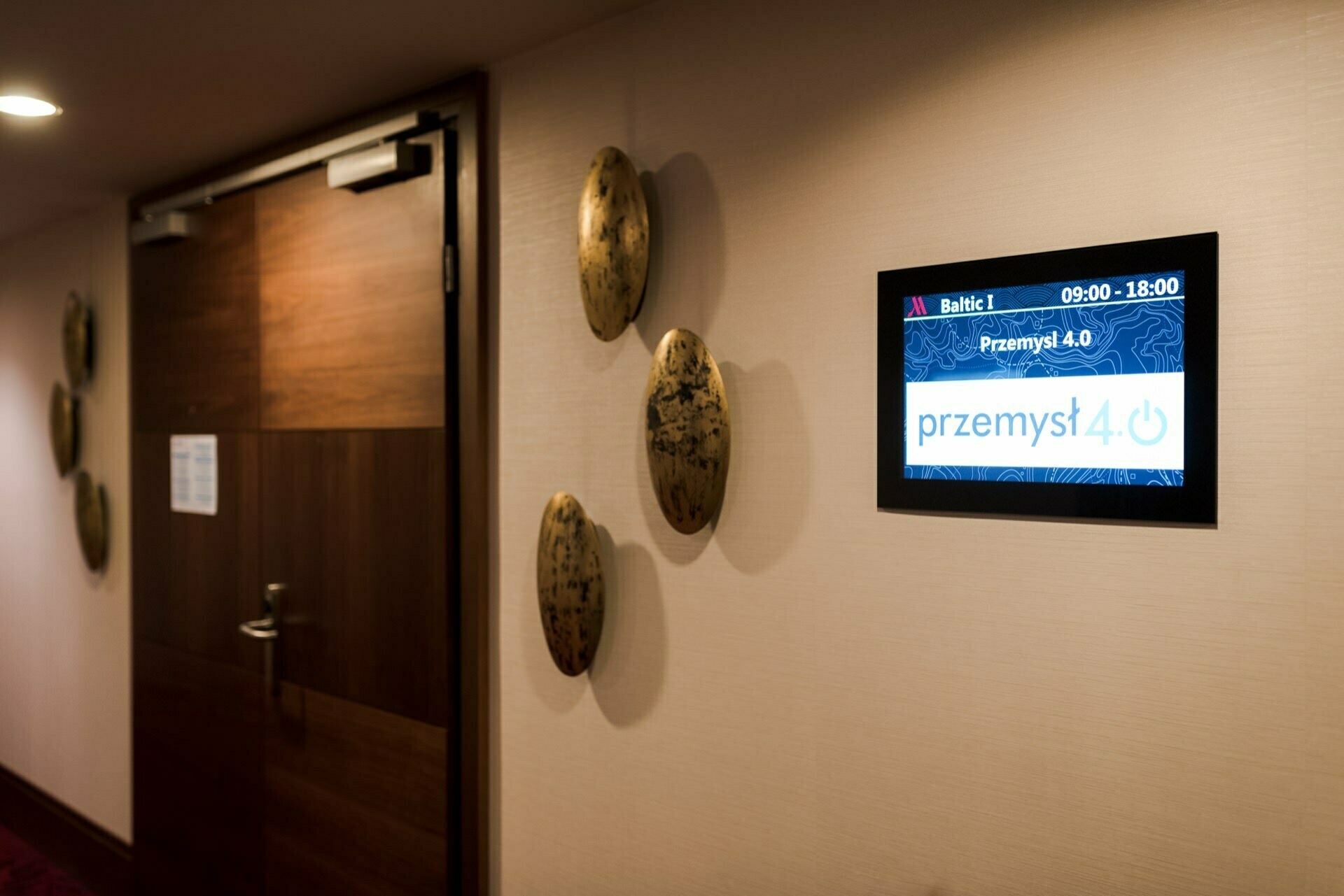 Entrance to the conference room with a screen