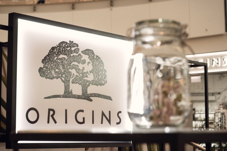 Origins logo with trees