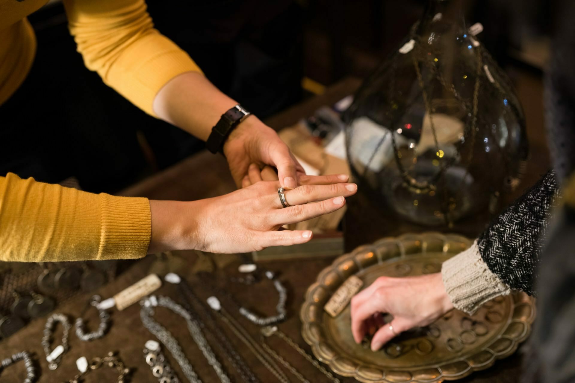 A woman tries on a breastplate on her hand