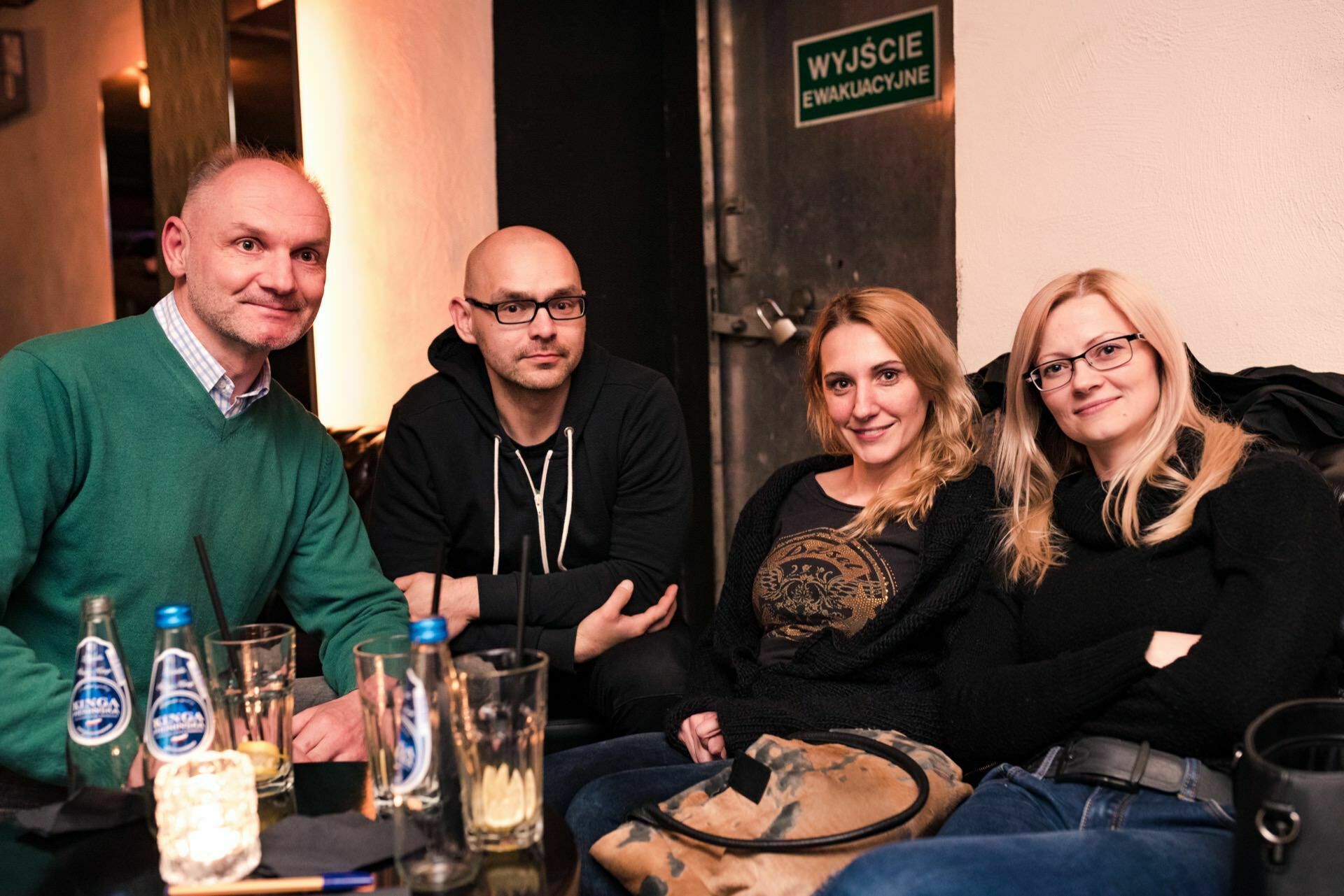 Two girls and two men sit together