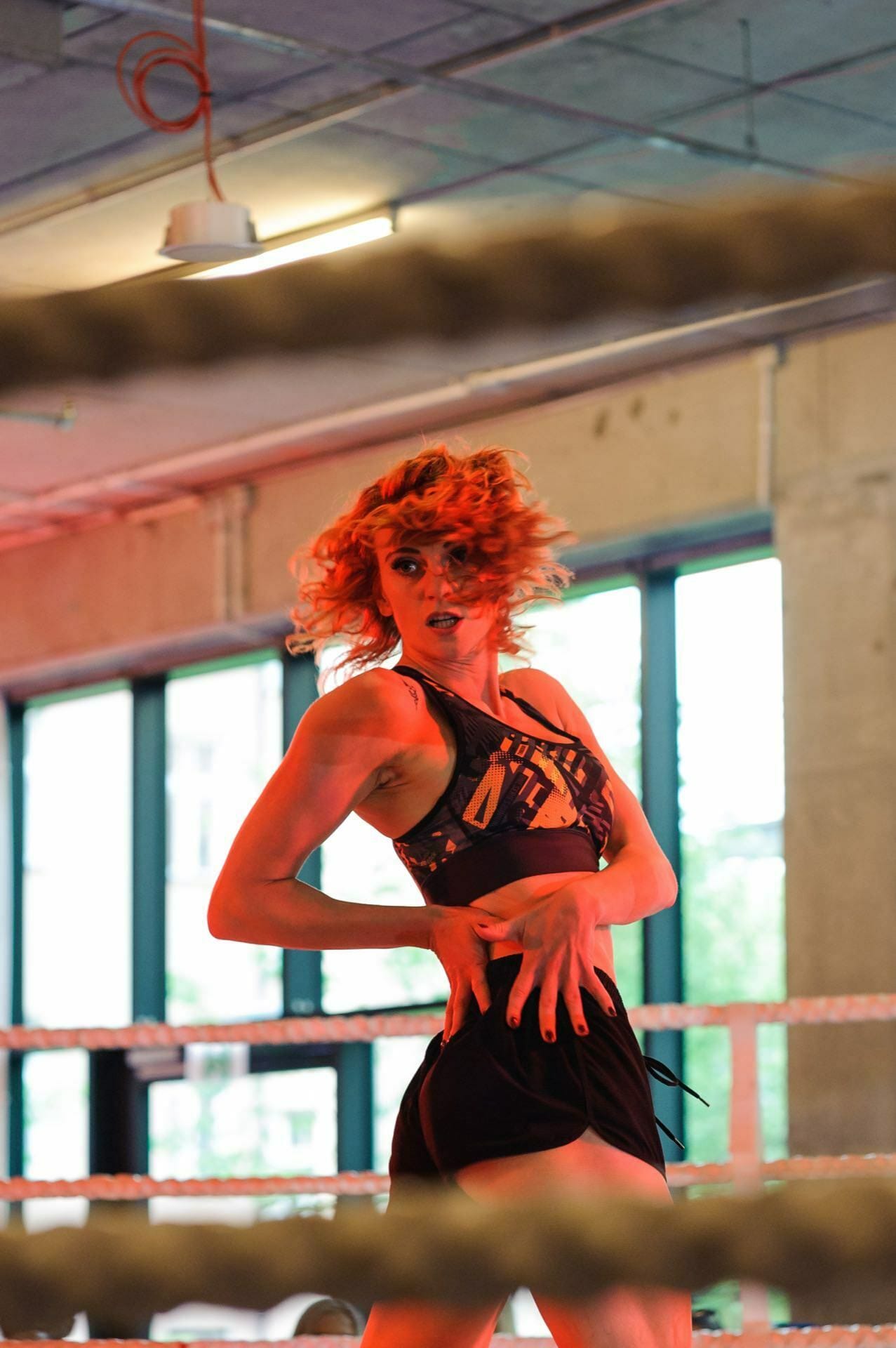 Redheaded girl dances in the ring