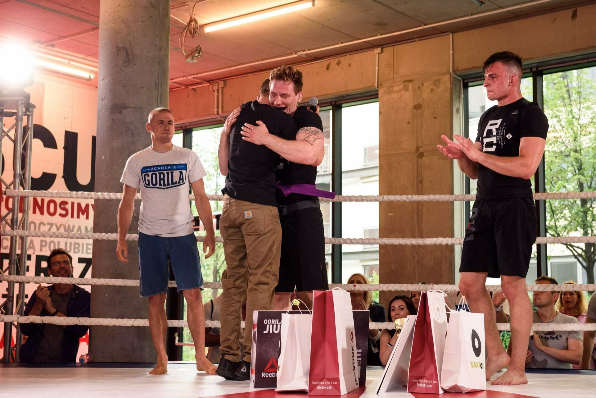 Competitors congratulate each other in the ring