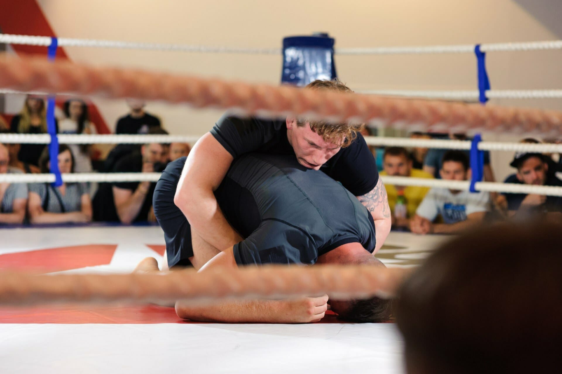 Competitor grabs opponent on the mat