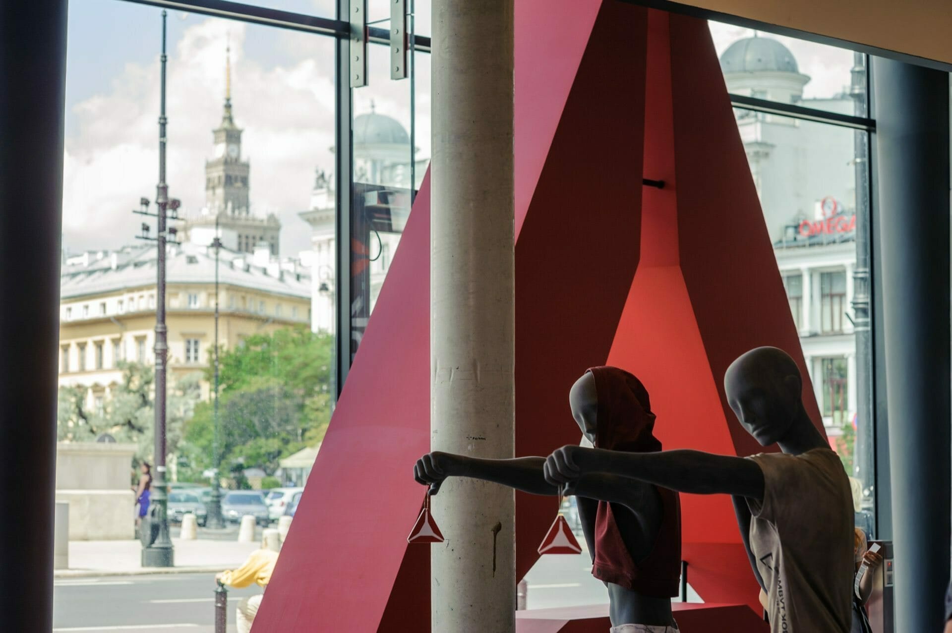 Mannequins in the Reebok fit store And the Palace of Culture in the background outside the window