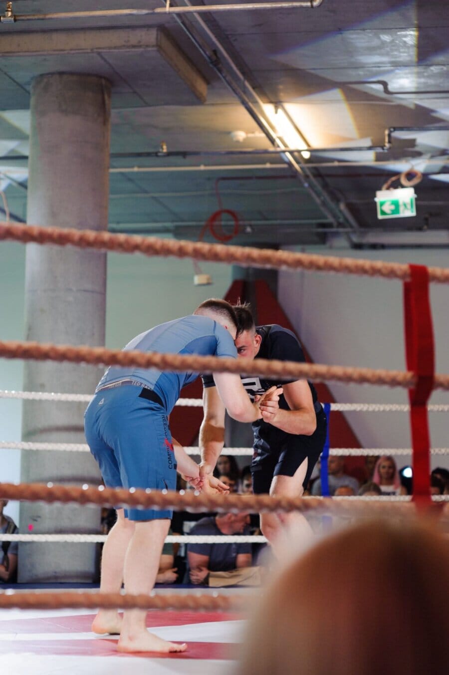 Men touching heads in the ring