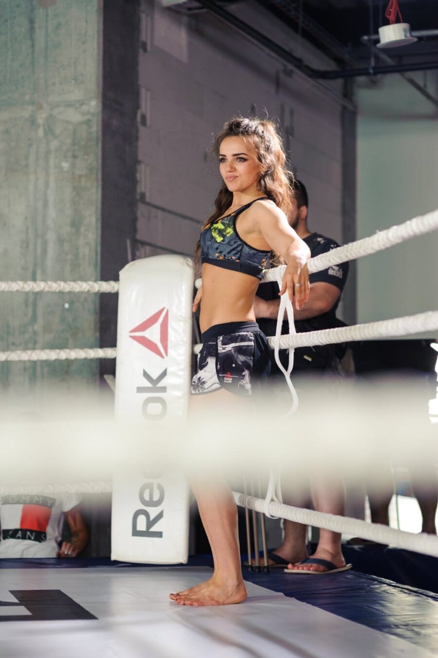 Ring girl in corner with Reebok logo