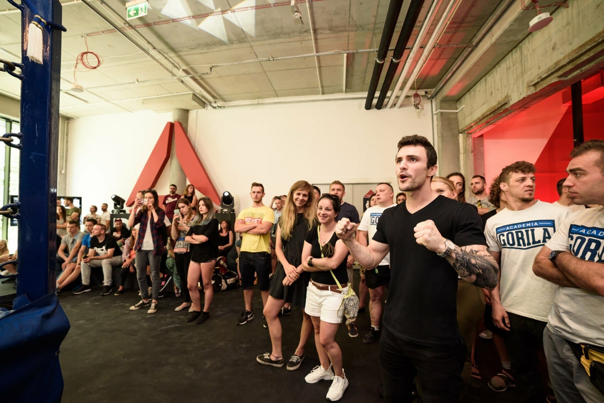 The audience cheers during the fight