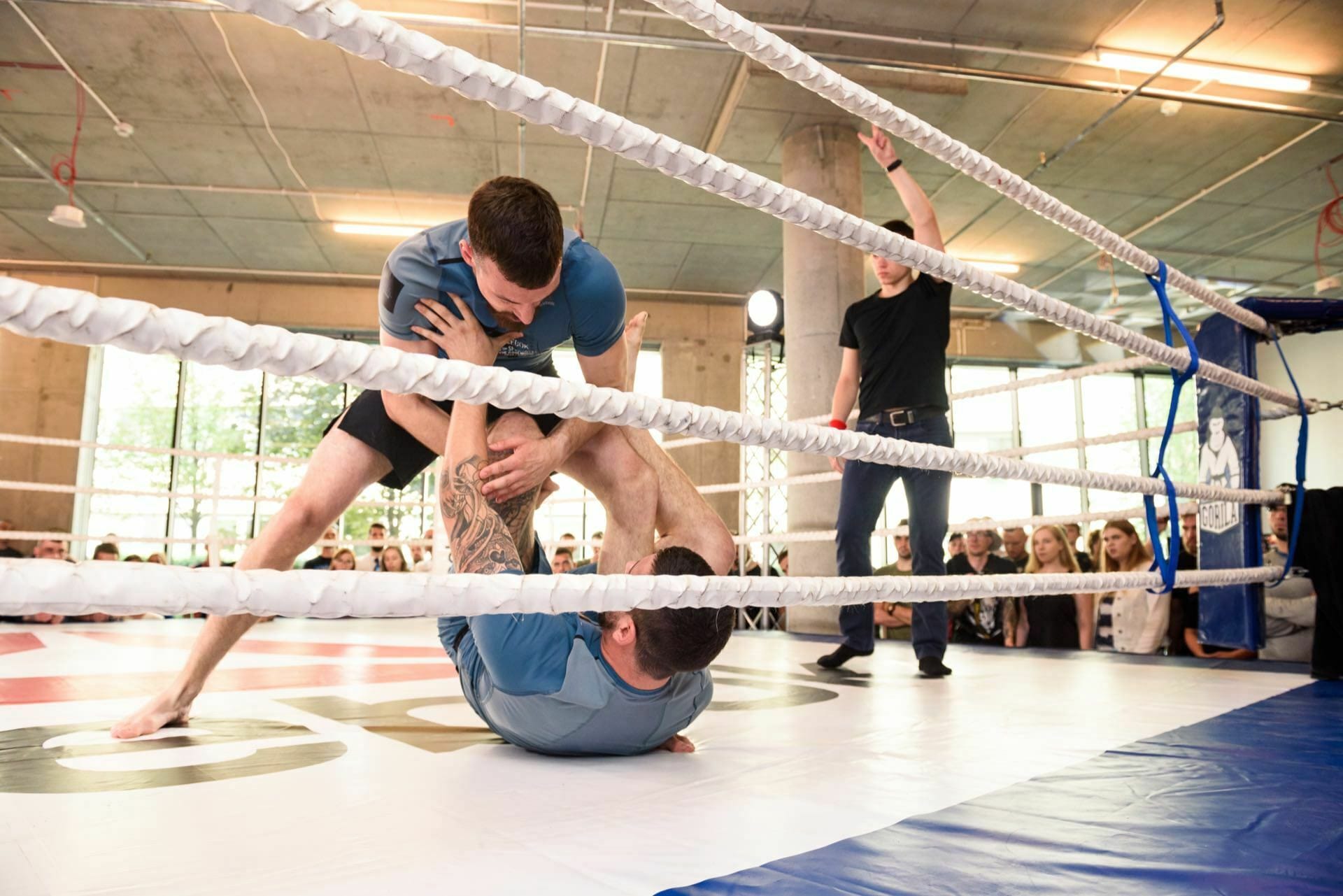 Competitor pressed against the mat