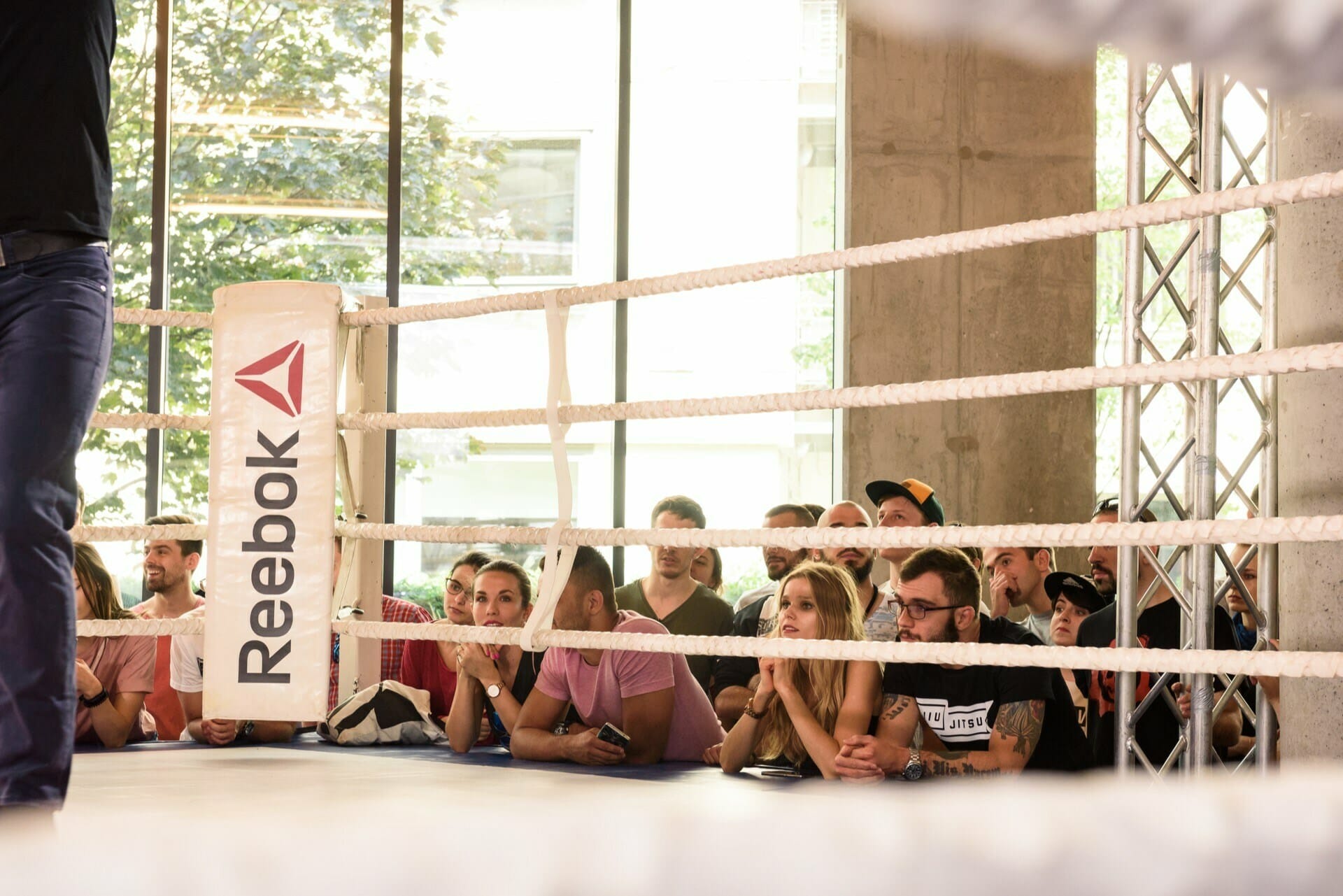 The audience watches the fight