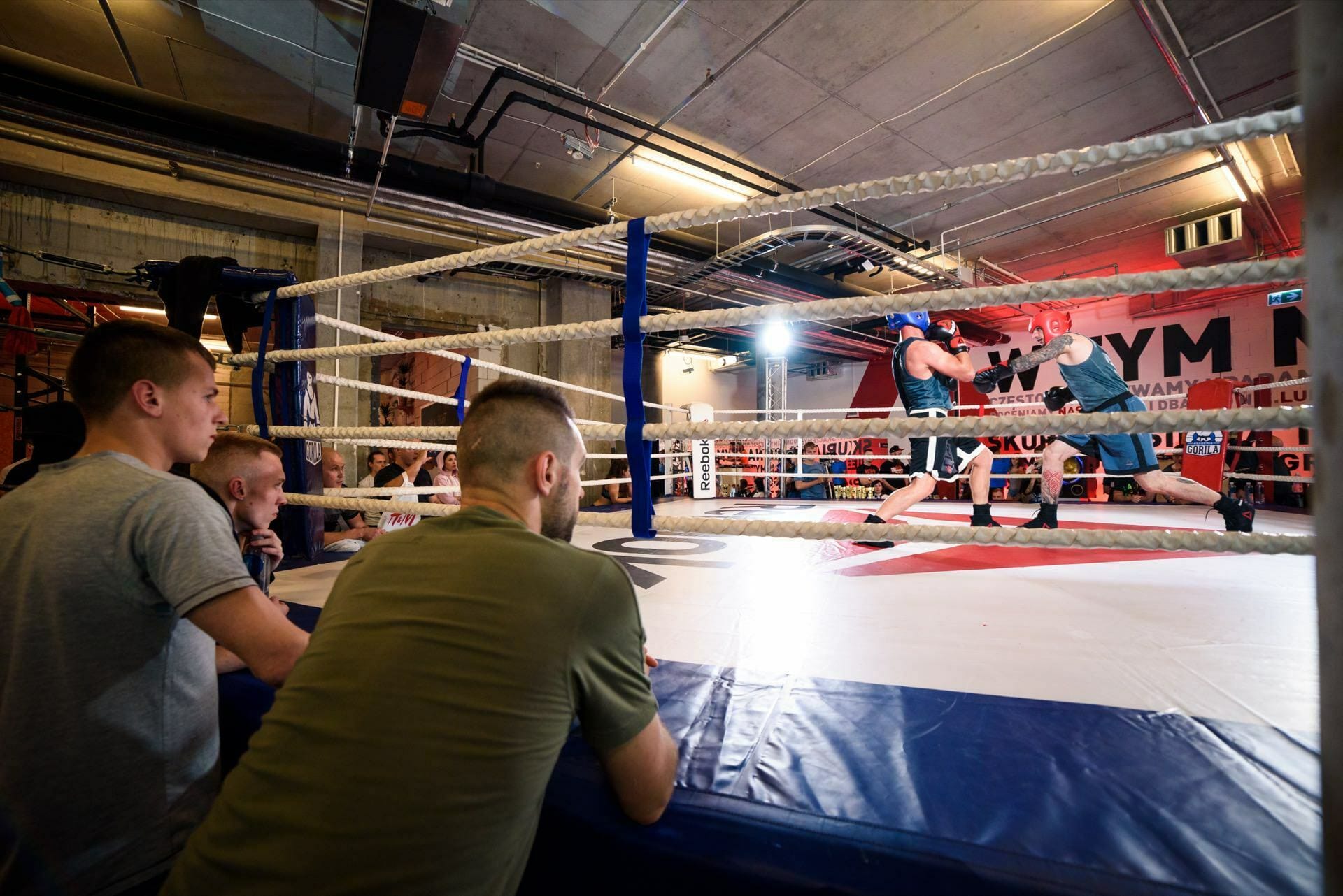 A competitor waves his fists in the ring