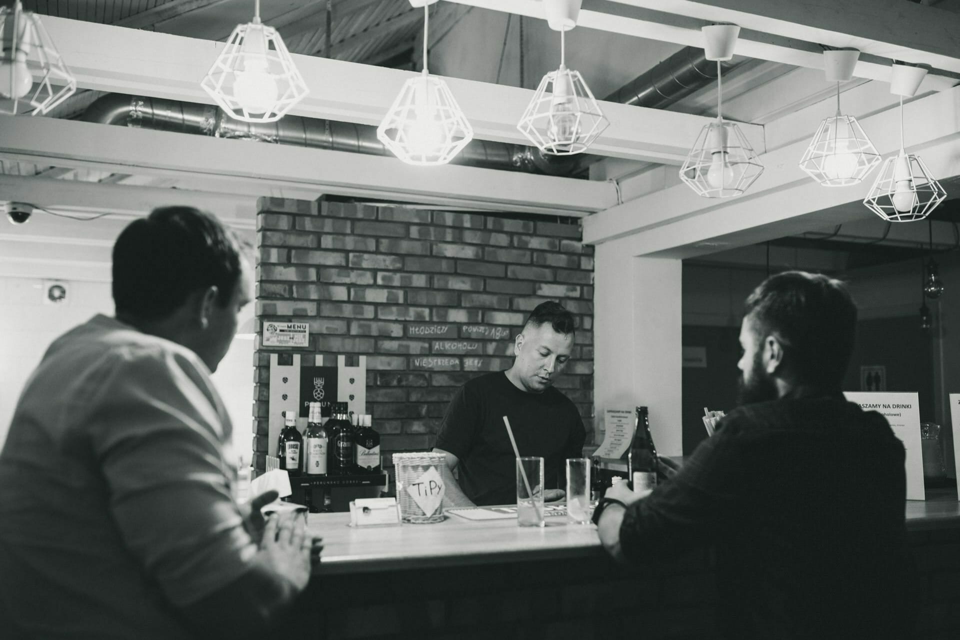 Bartender makes drinks at the bar