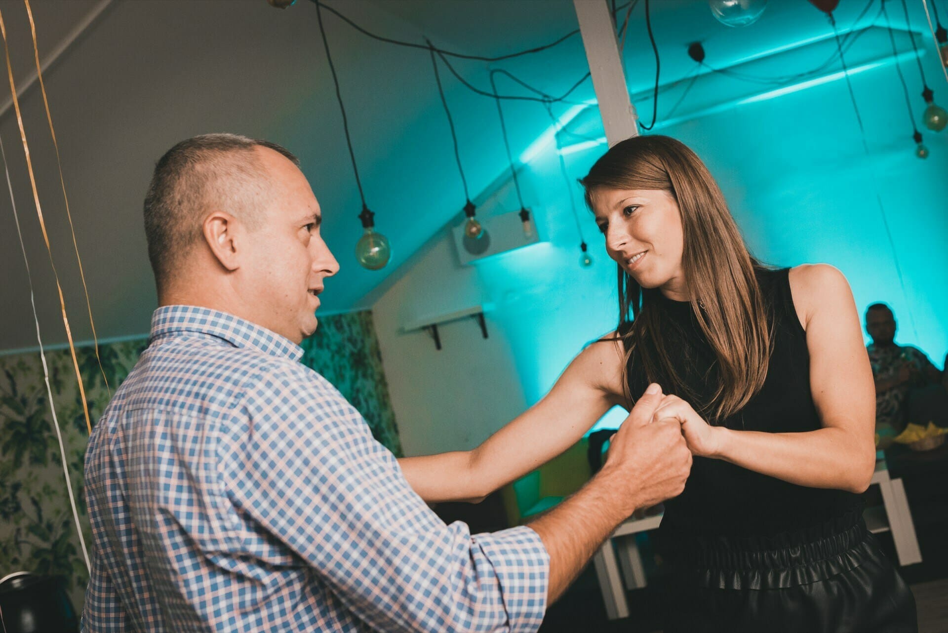 Couple dancing on the dance floor during a birthday party