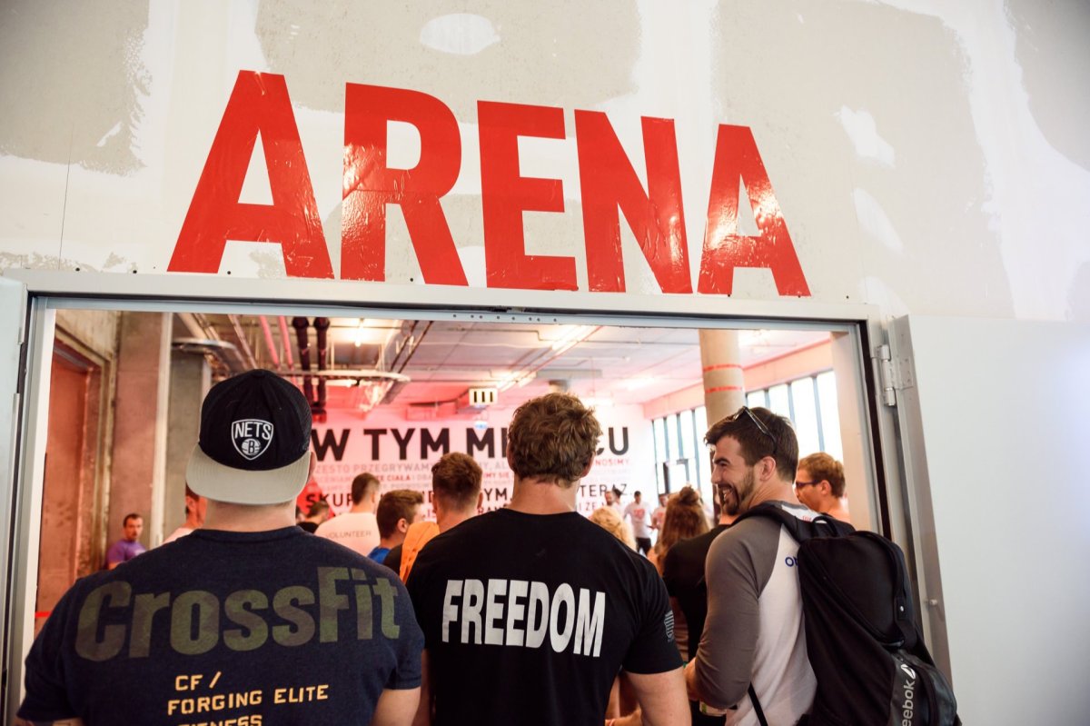 Three crossfit athletes enter the training room