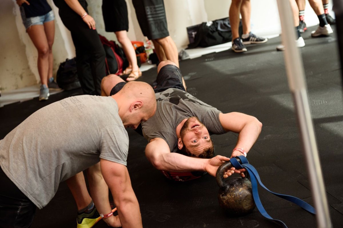 Lifting a kettle behind the head while lying down