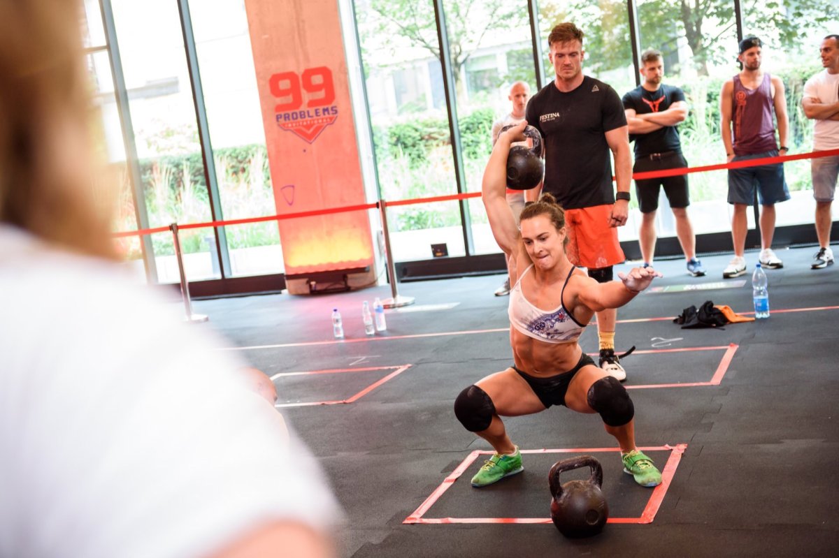 A girl lifting a weight over her head