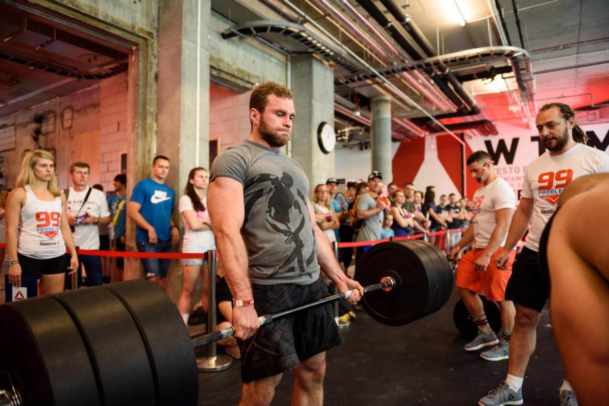 Boy lifts big weights