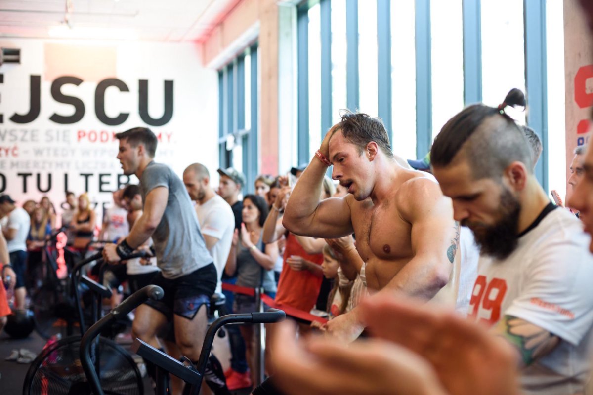 Tired athletes on exercise bikes