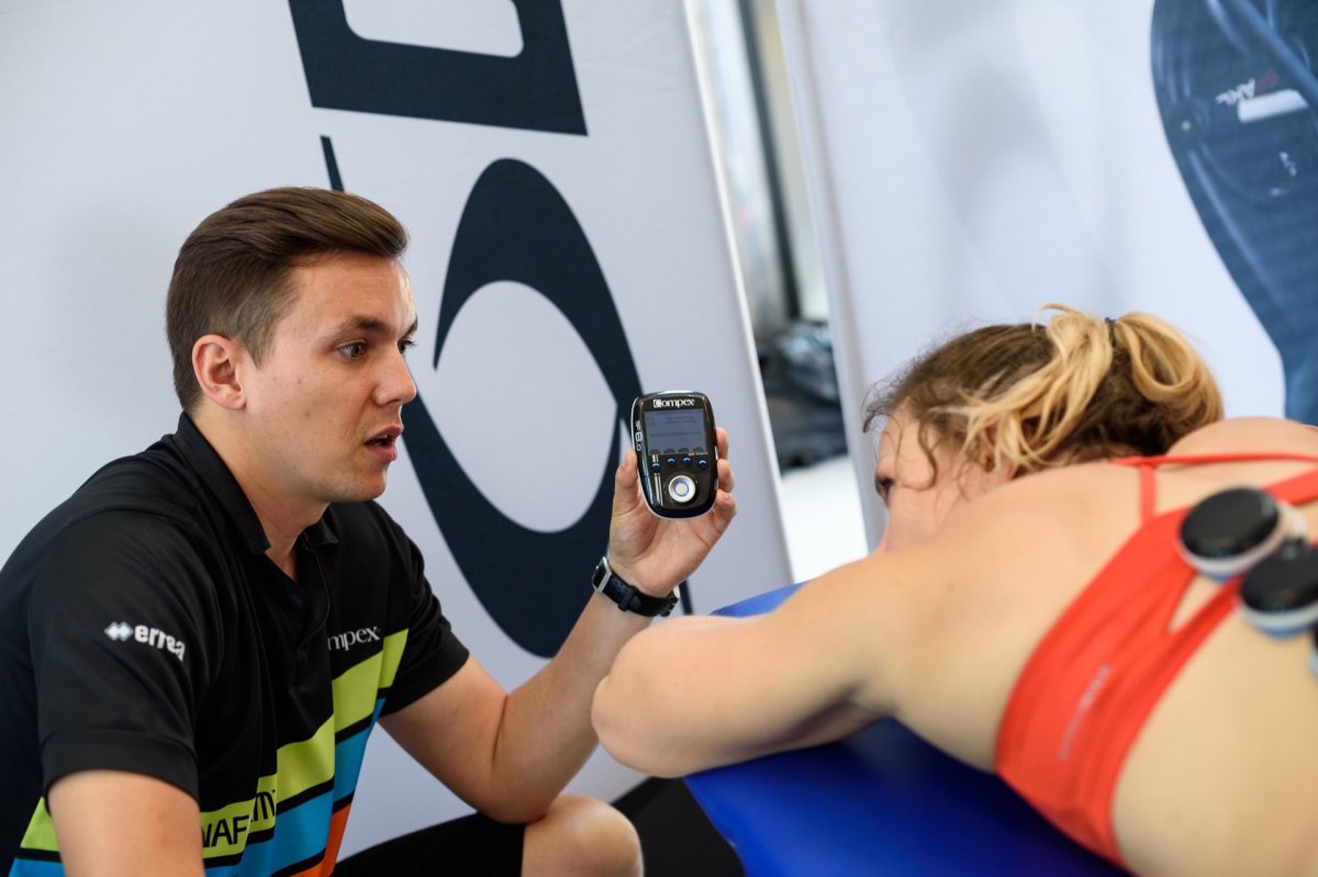 A man presents a device for electrostimulation of muscles