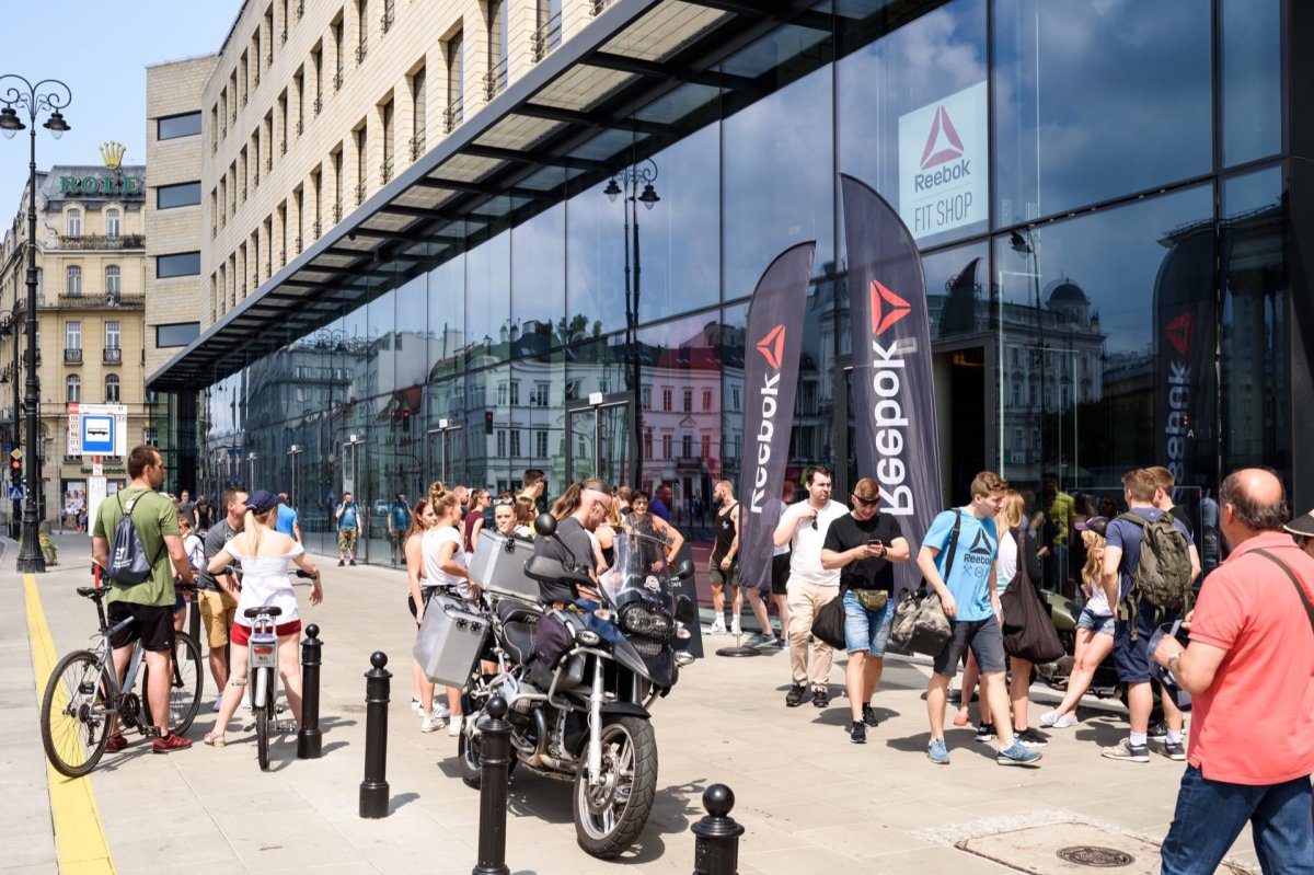 Entrance to Reebok Fit Shop in Three Crosses Square in front of which there is a crowd of people