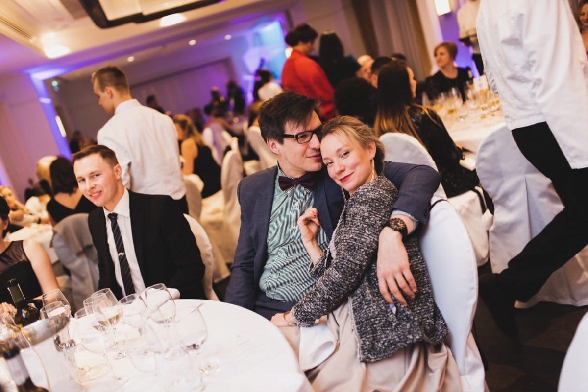 Man embracing woman at table