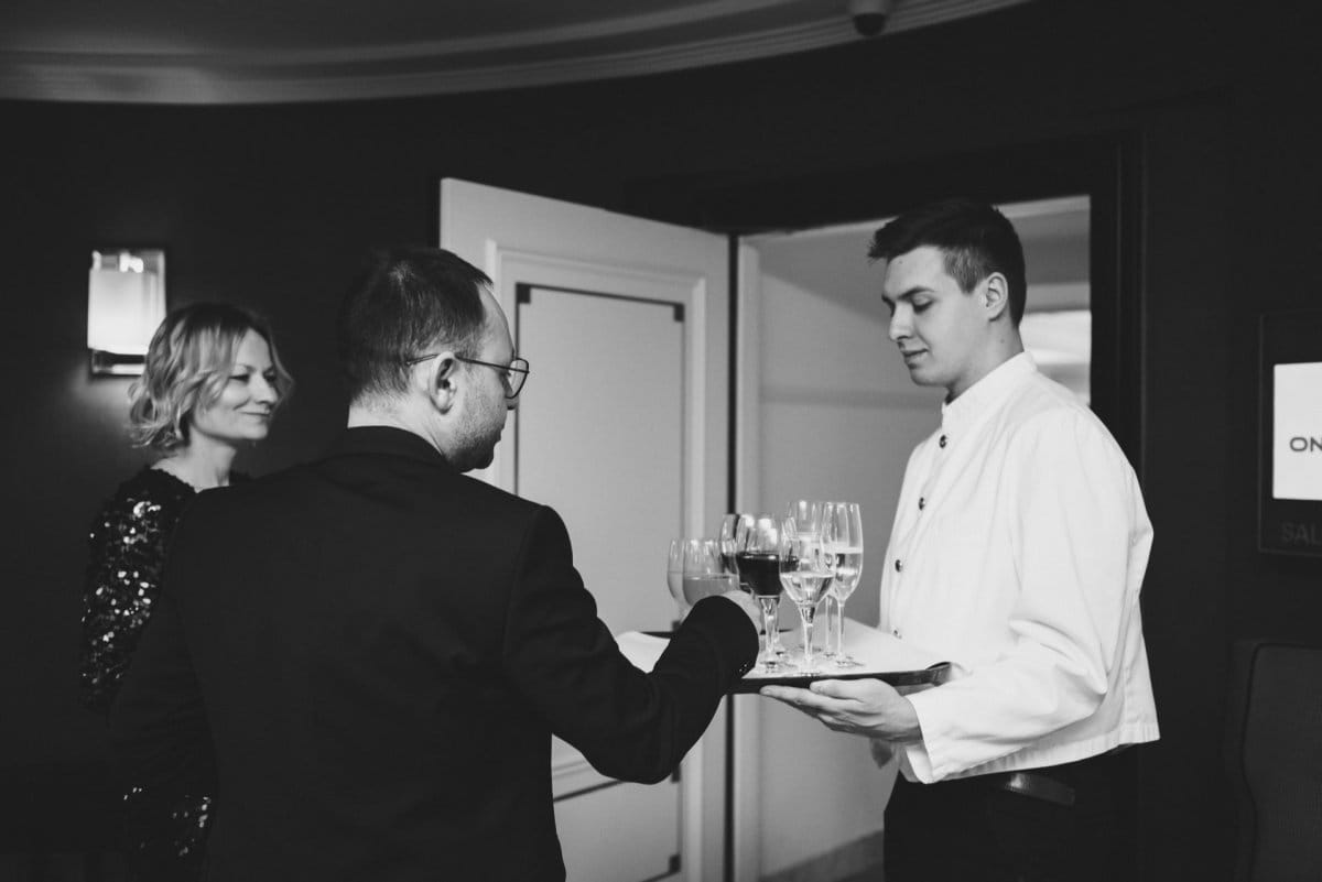 Bartender serves welcome drinks to guests