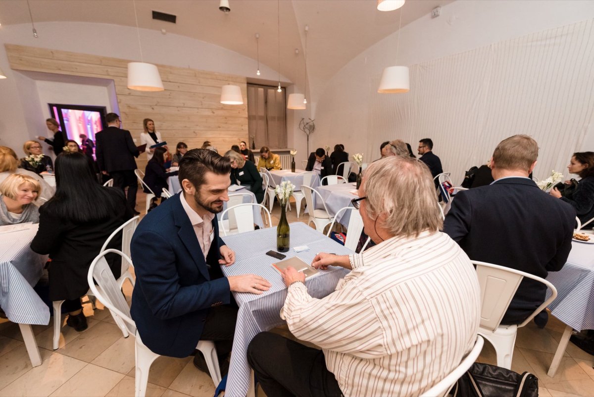 People at tables at the conference