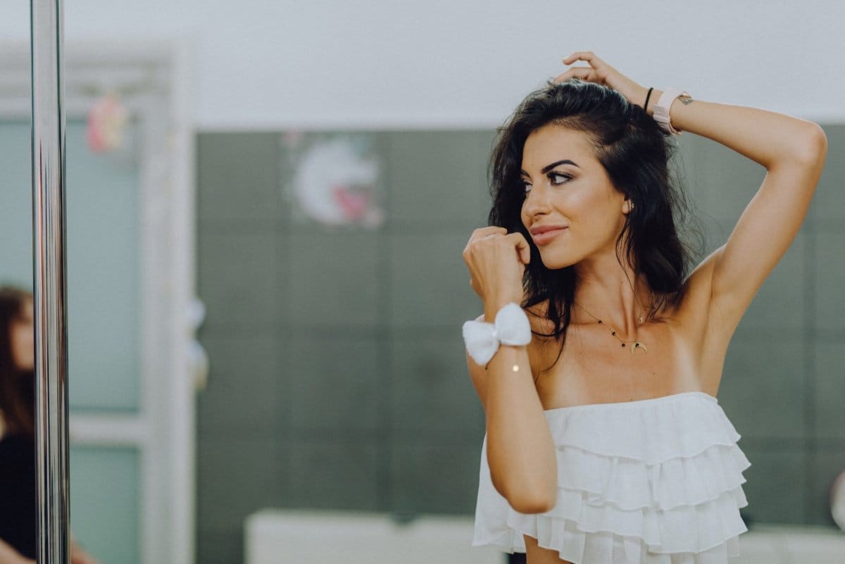 Girl dancing in a white blouse