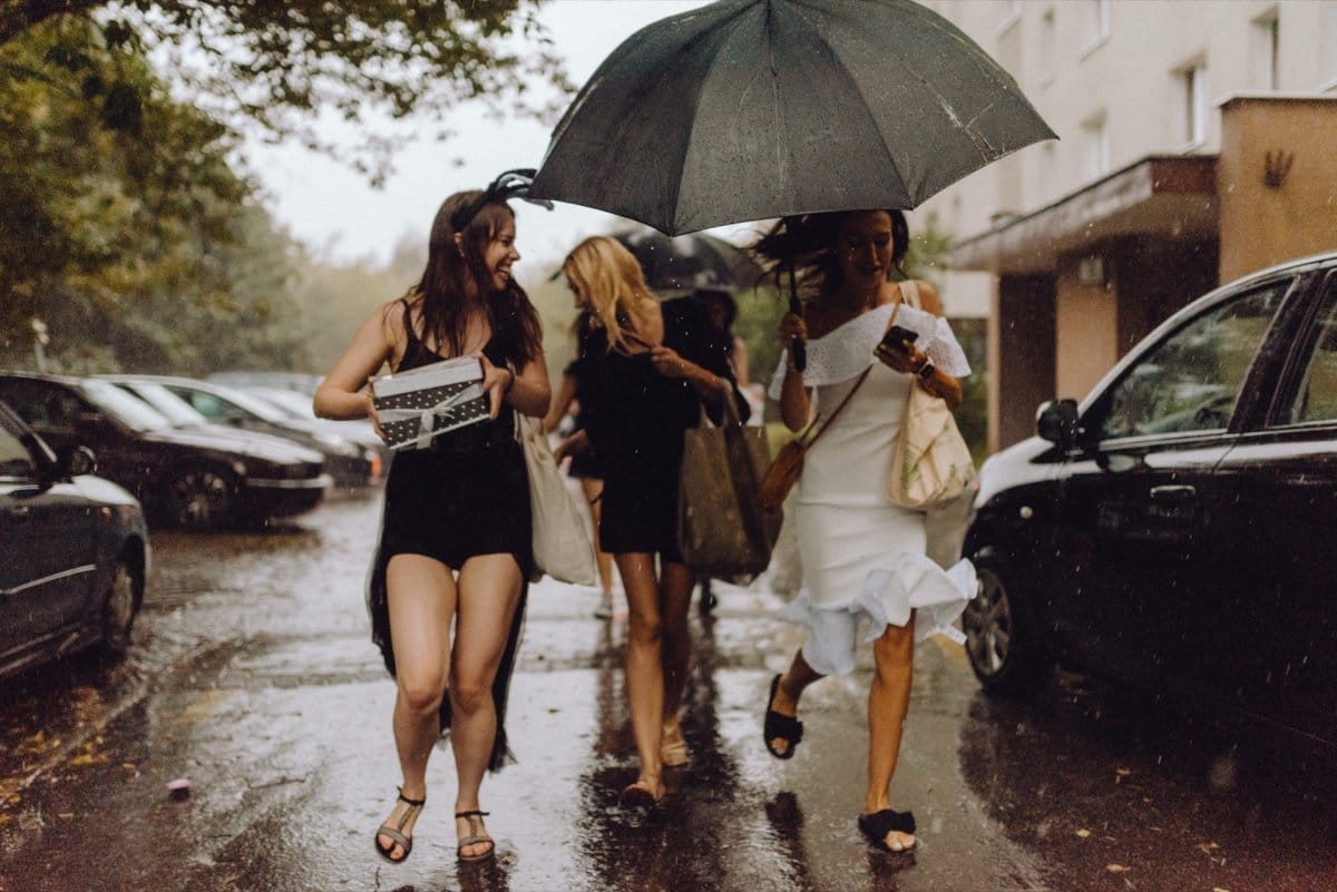 Girls in the rain at a bachelorette party Girls in the rain at a bachelorette party escape the rain