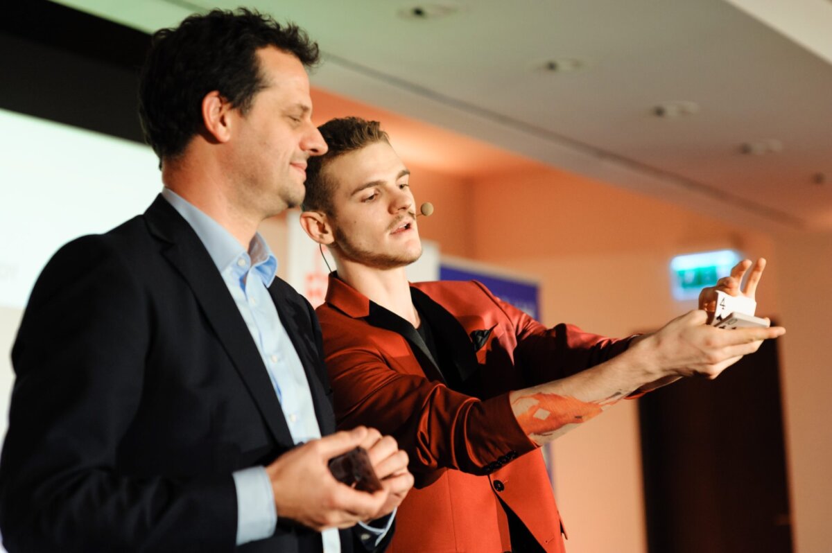 Boy demonstrating a card trick