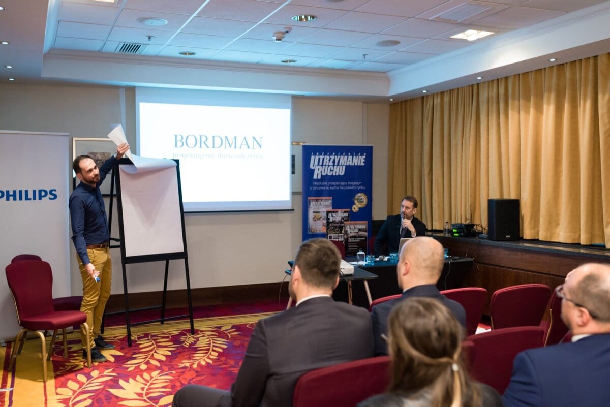 A man changing the page on a flipchart