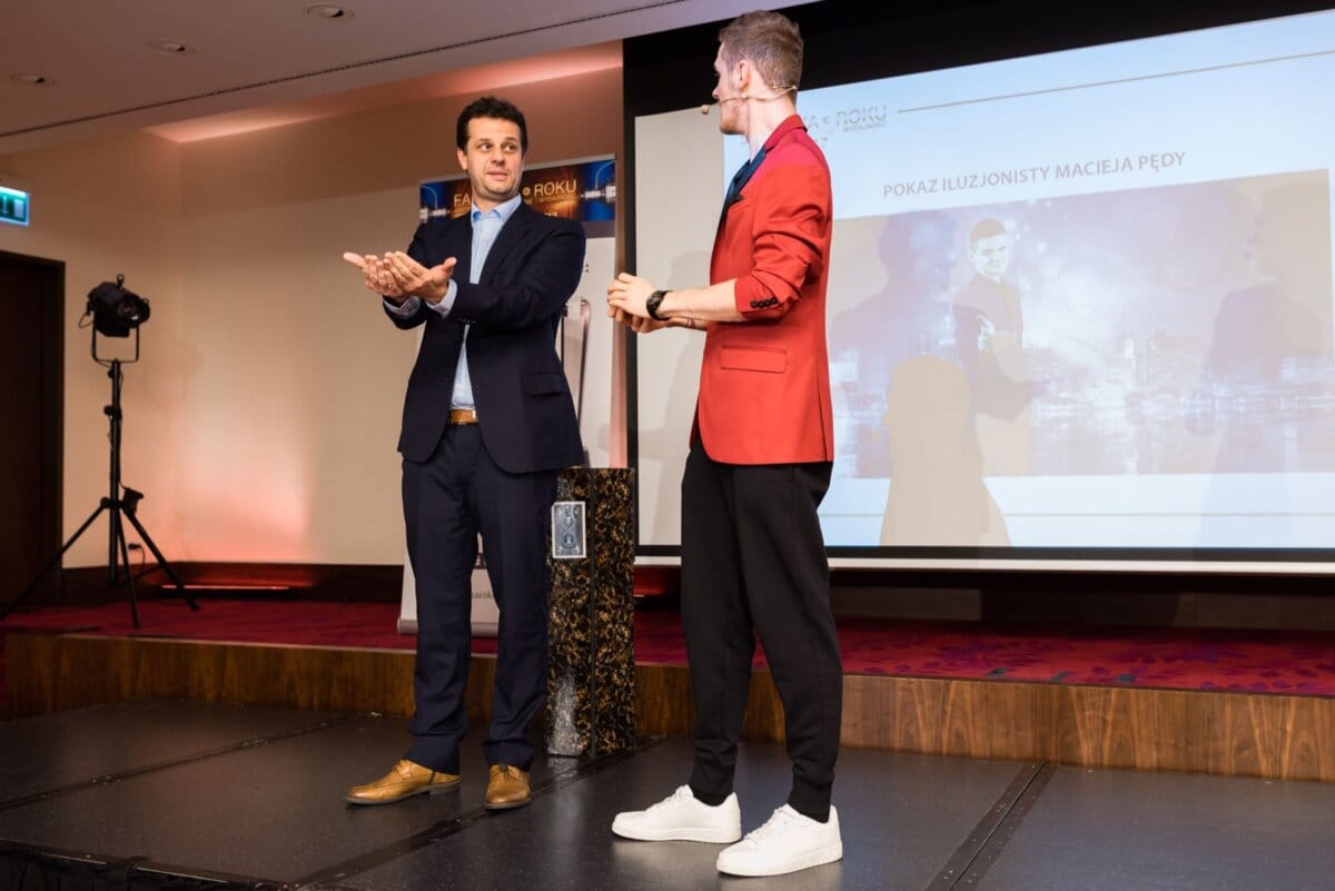 Two men on stage during illusionist's performance