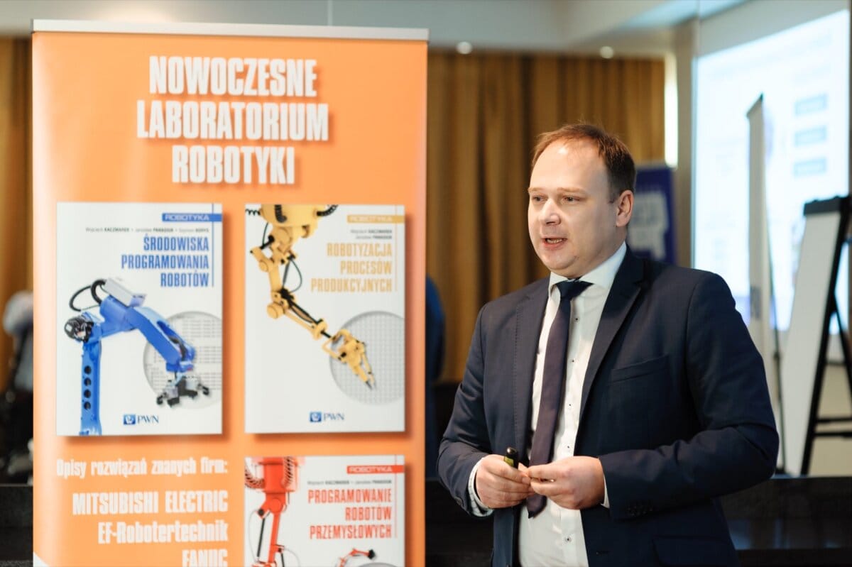 A man speaking at a conference hall