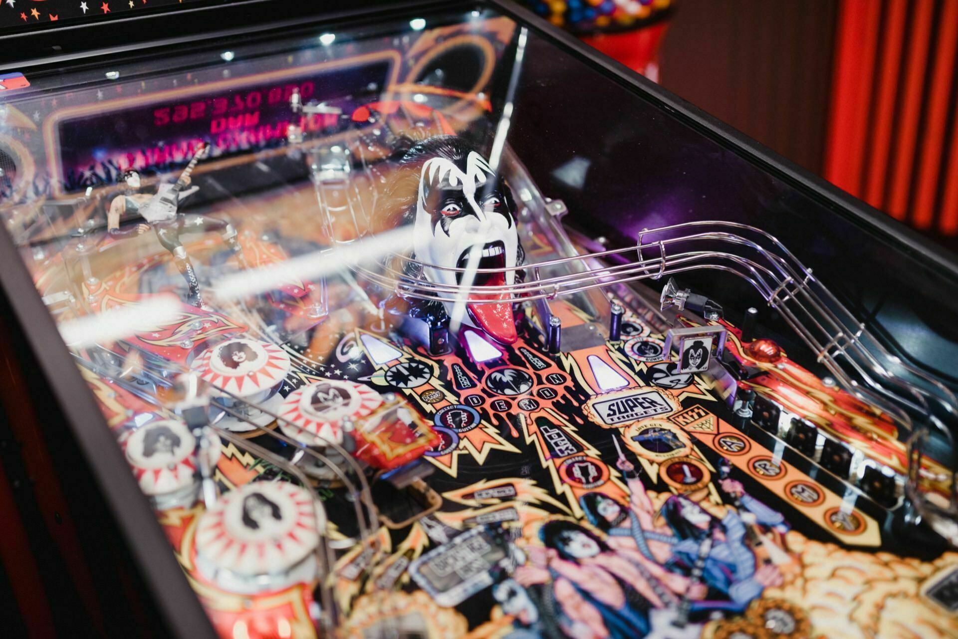 The colorful flipper is reminiscent of the rock band KISS and features vibrant graphics depicting the band members and various iconic elements from their performances. The intricate design of the machine includes bumpers, fins and ramps, all adorned with KISS images - perfect for photo opportunities at events. 