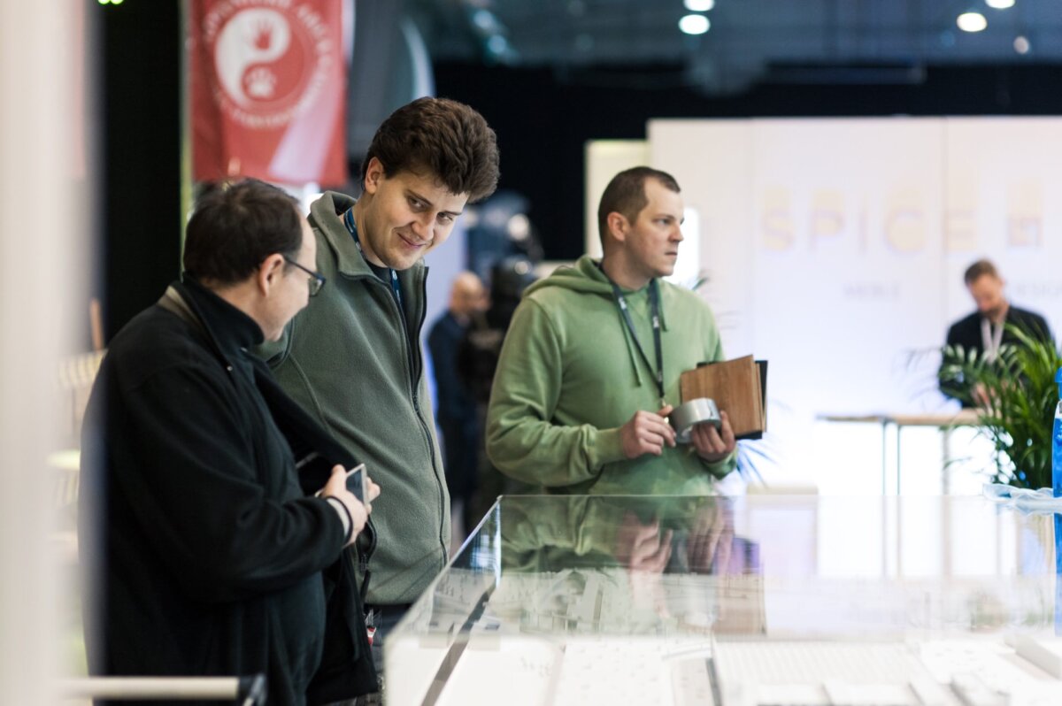 Men talking at a glass display case