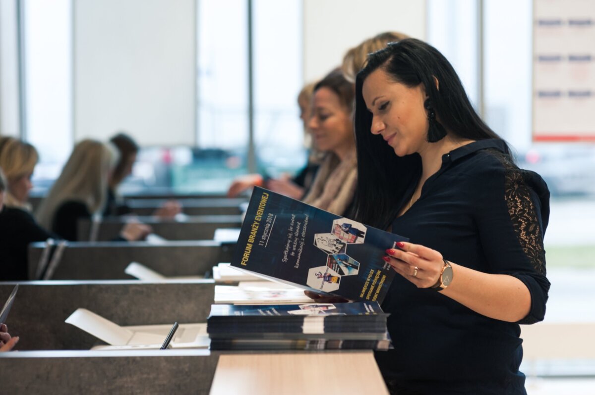 Woman looking at catalogs at the reception desk