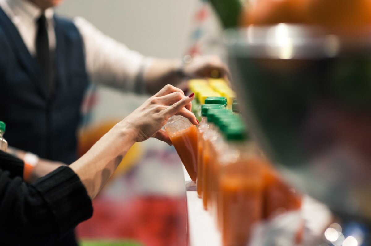 Woman's hand grasping juice bottle