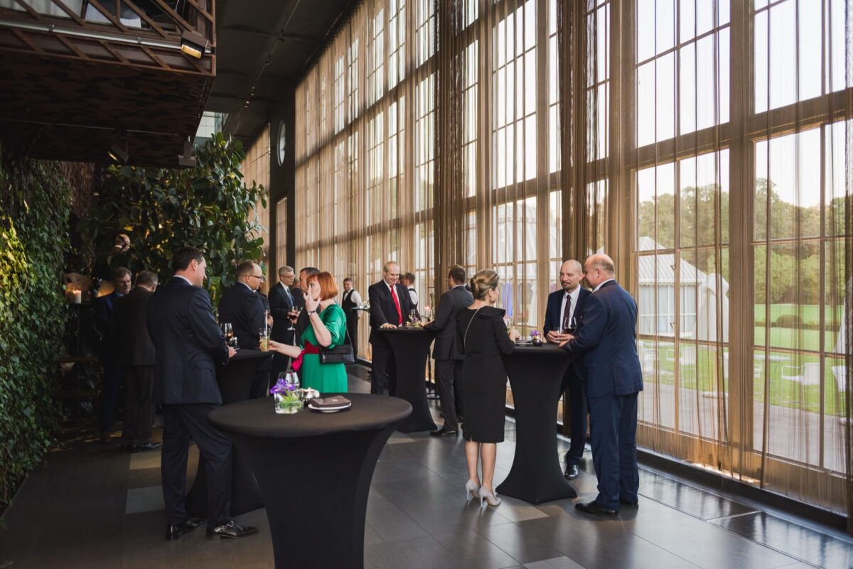 A glass wall of the Belvedere orangery with a view of the park during the cocktail reception
