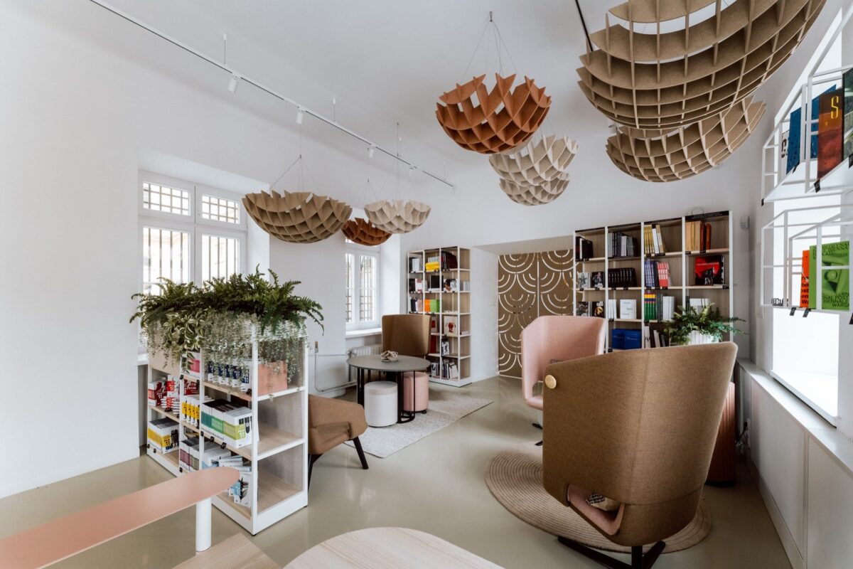 Narbutas furniture display with armchairs and openwork shades under the vault