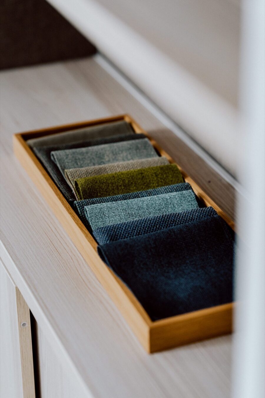 Upholstery fabric samples in a Narbutas display drawer