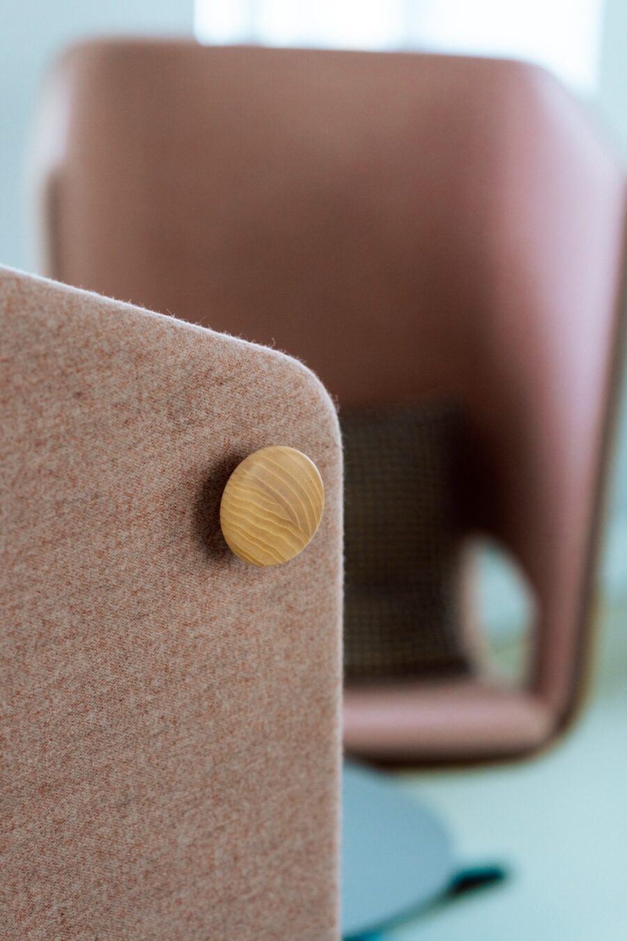 Detail of a Narbutas acoustic screen with a wooden knob