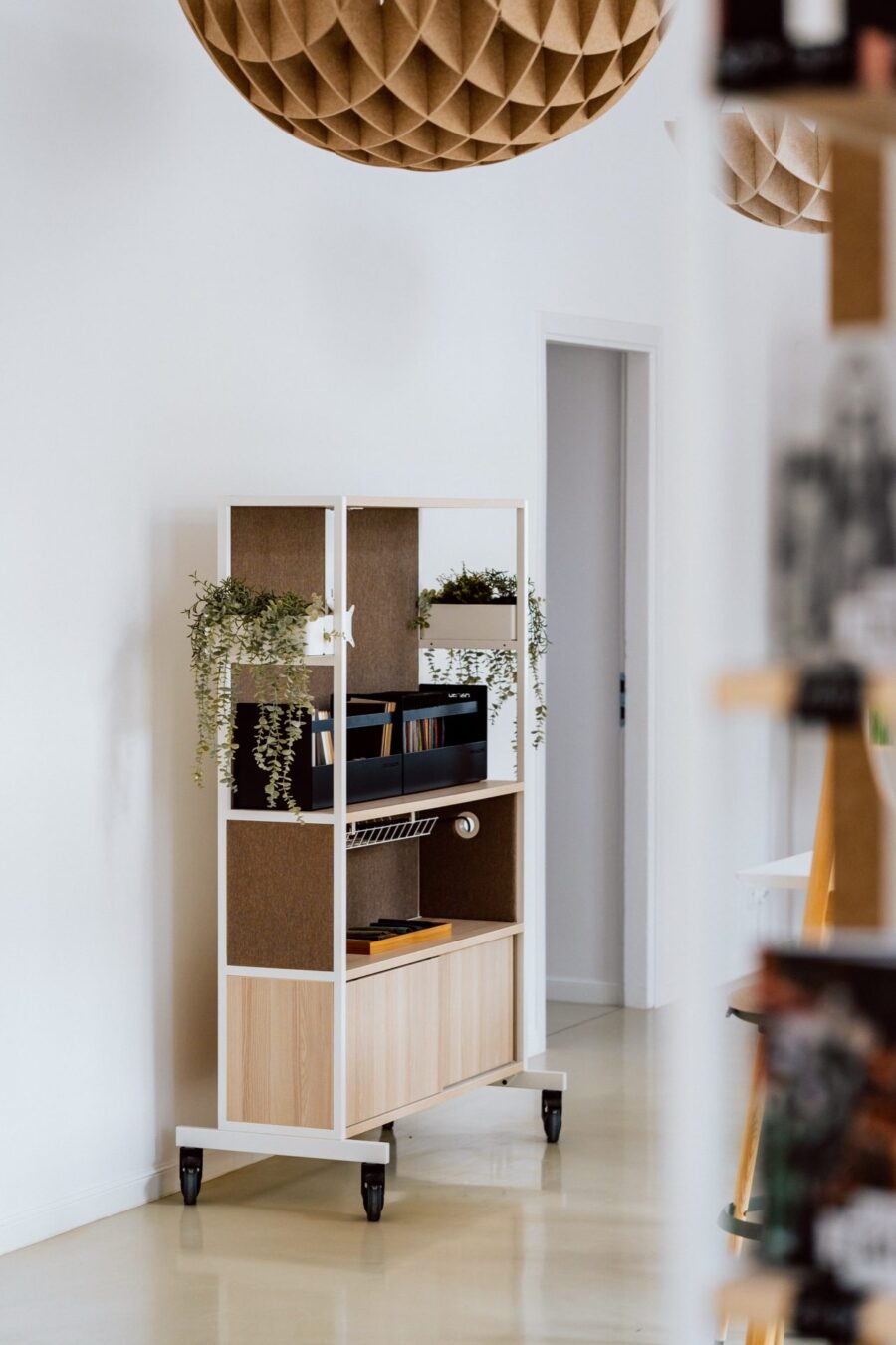 Mobile Narbutas shelving unit on castors in the showroom passage