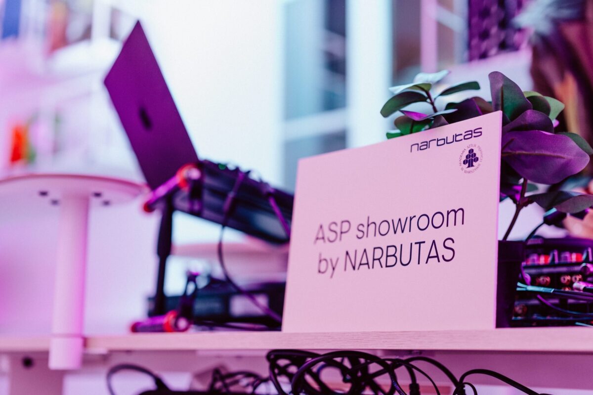 Sign with the name ASP showroom by Narbutas at the DJ booth